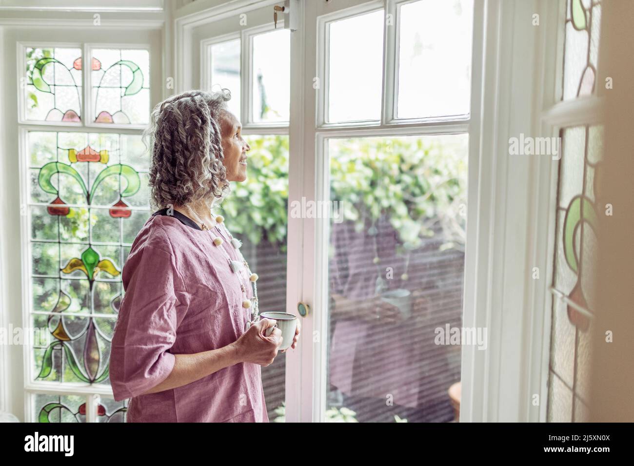 Tea and window hi-res stock photography and images - Alamy