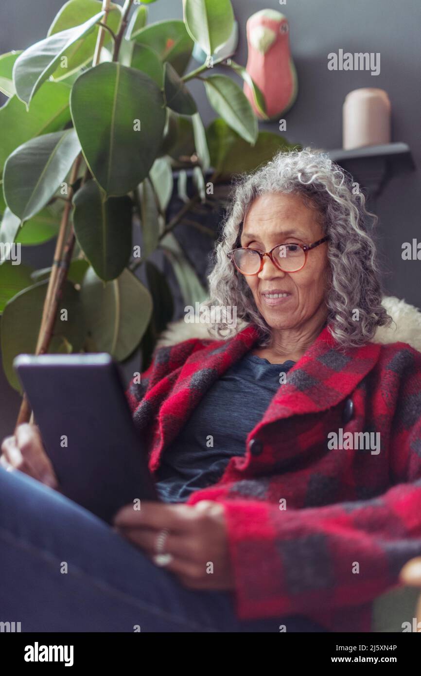 Senior woman using digital tablet Stock Photo