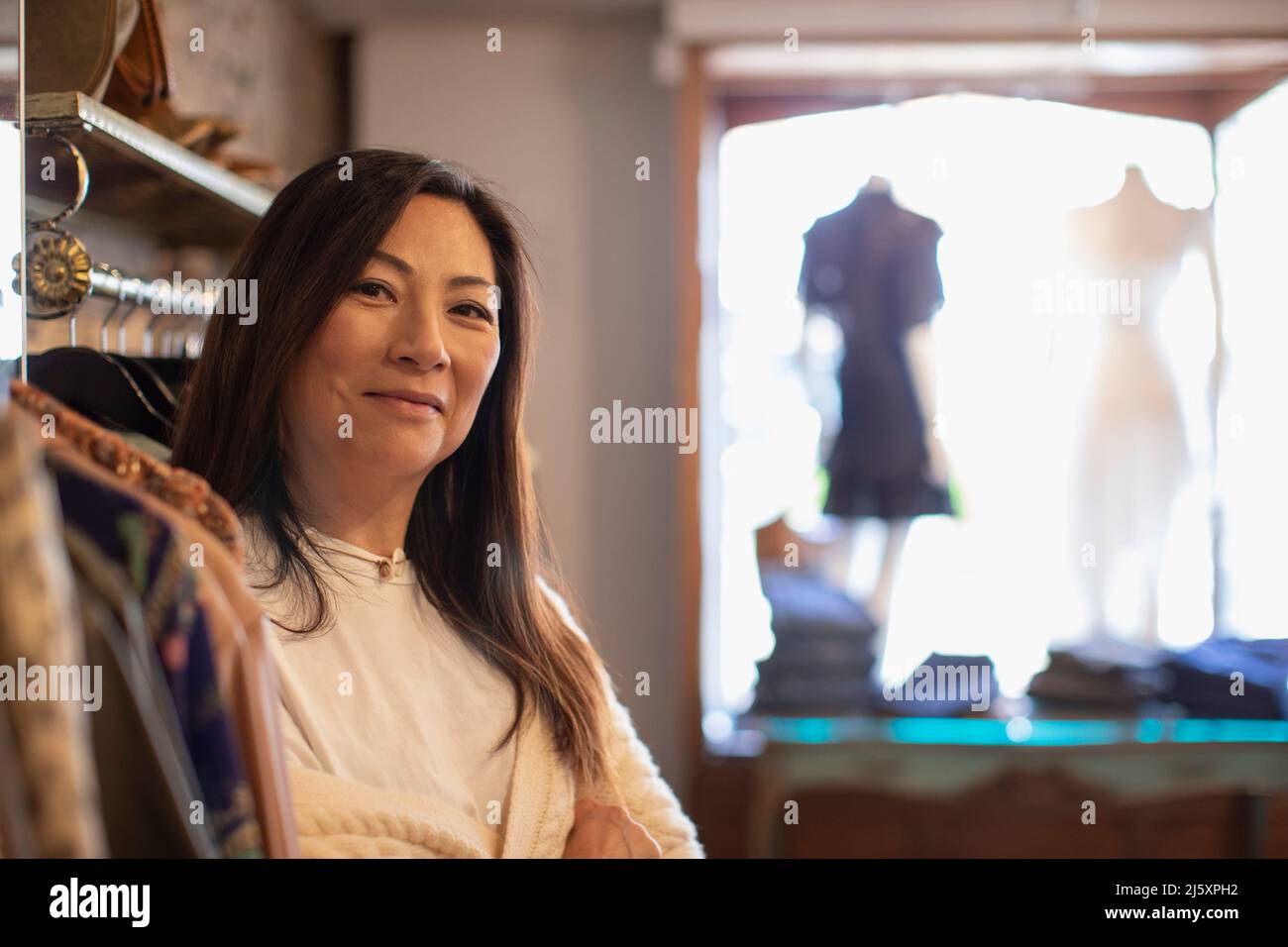 Portrait confident female shop owner in clothing boutique Stock Photo
