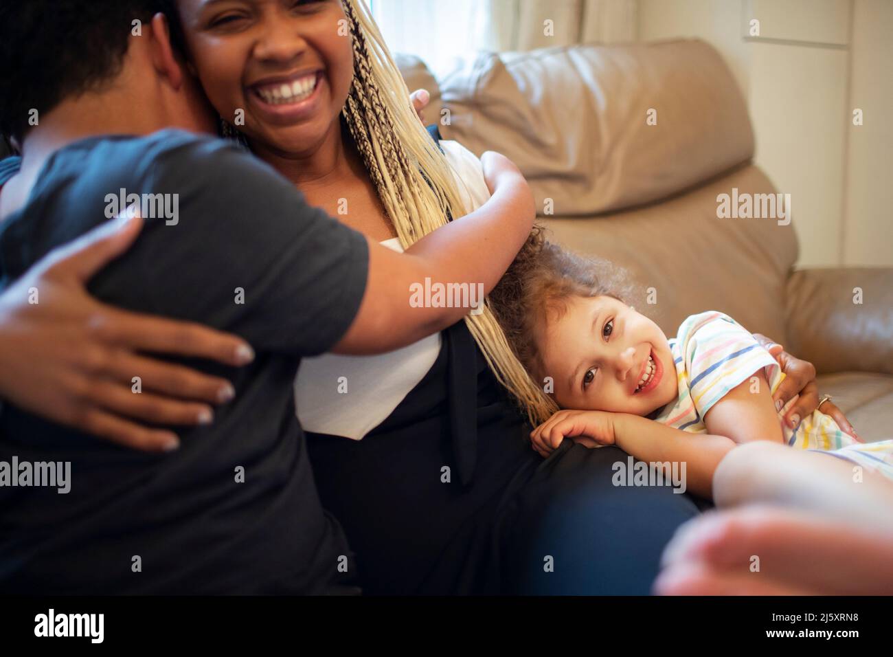 Portrait happy affectionate mother and kids hugging Stock Photo
