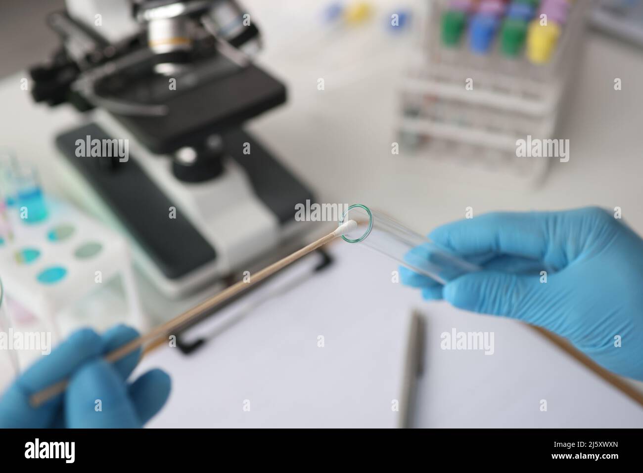 Doctor of laboratory diagnostics making DNA examination to determine paternity closeup Stock