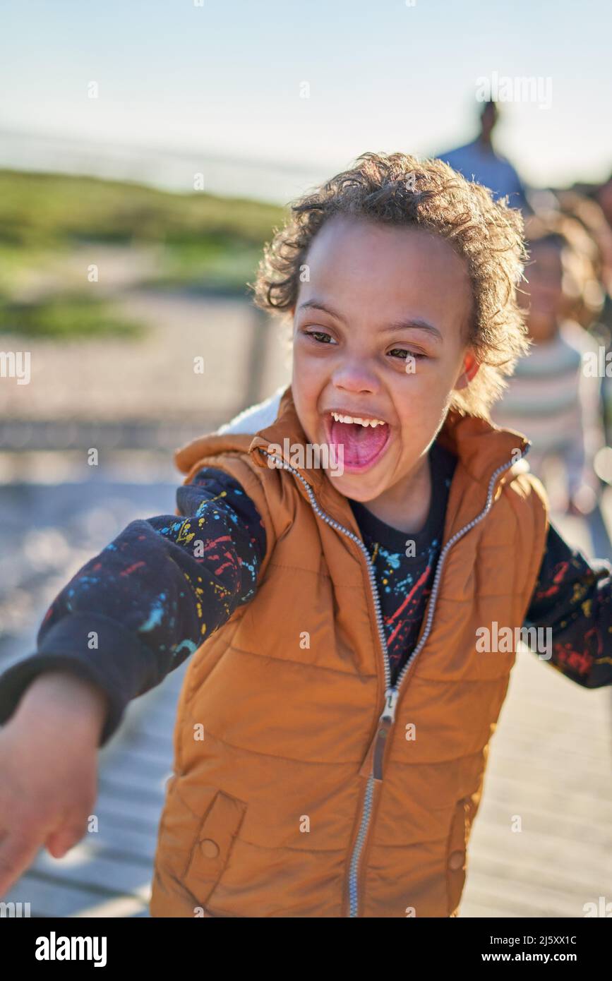 Happy, playful boy with Down Syndrome Stock Photo