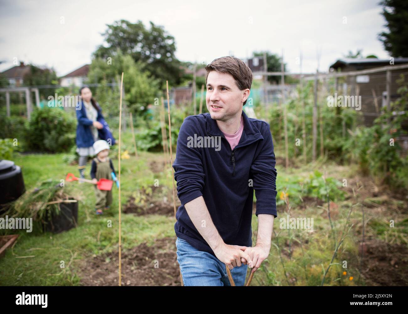 Portrait smiling man looking away in garden Stock Photo