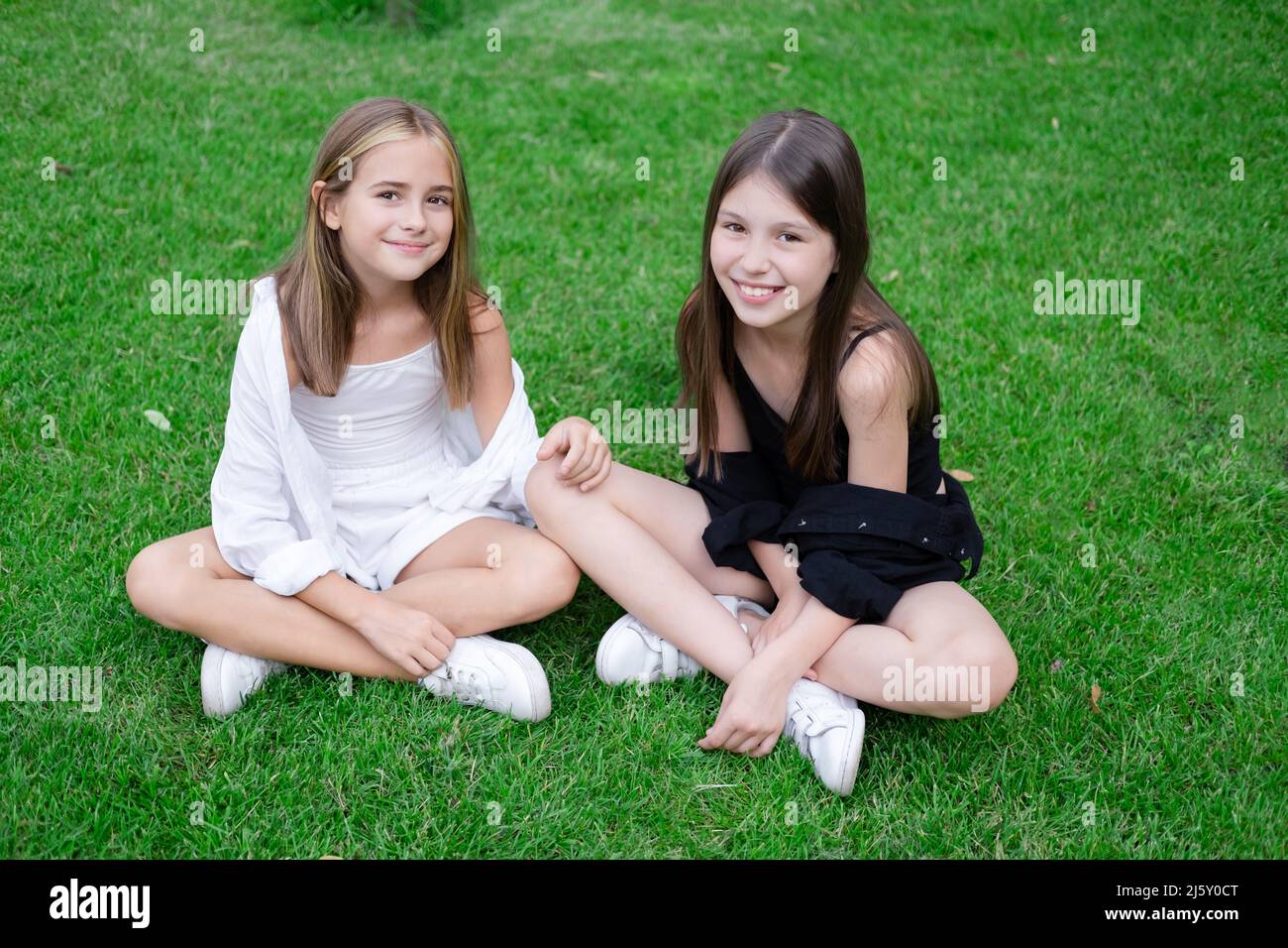 Fraternal Twins Sisters Blonde And Brunette Teen Girls In Fashionable