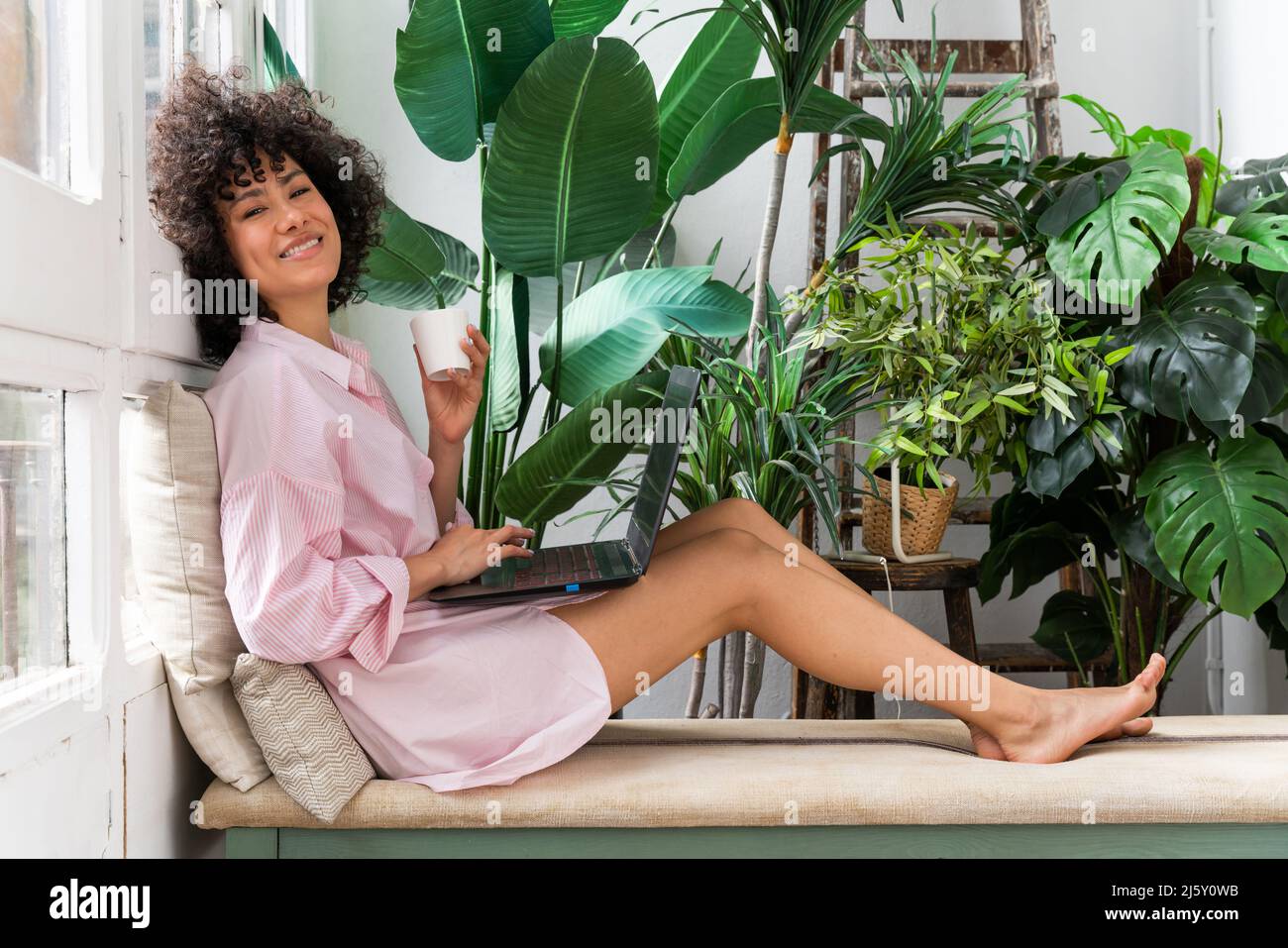 Beautiful latino young woman at home - Pretty south american with curly ...