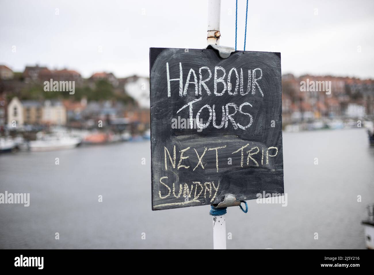 WHITBY, ENGLAND, UK. April 25th 2022. General close-up view of a handwritten chalkboard information sign in Whitby harbour. Stock Photo
