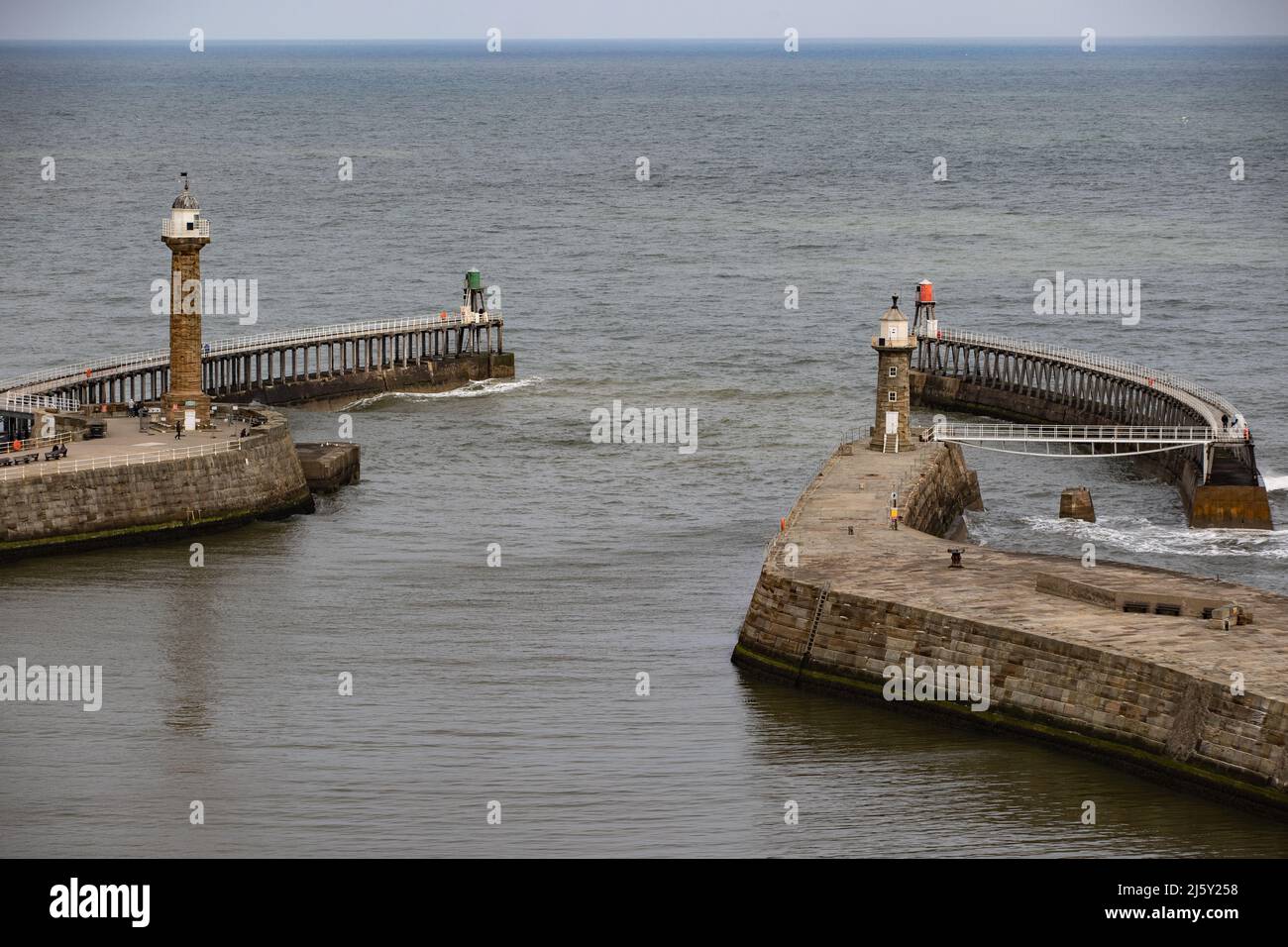 WHITBY, ENGLAND, UK. April 25th 2022. Whitby harbour and the two lighthouses are seen during goth weekend. Stock Photo