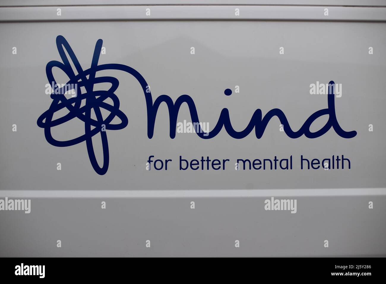 WHITBY, UK. April 25th 2022. Close-up view of a mind charity sign on a van in Whitby town centre during goth weekend. Stock Photo