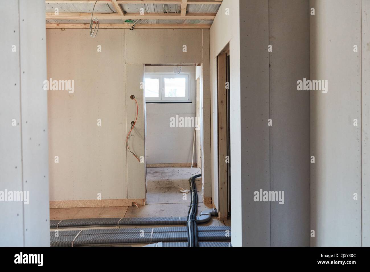 Hallway or corridor in house in new construction project with door opening Stock Photo