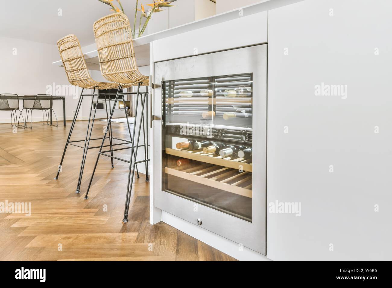 Bottles with alcohol in modern wine with humidity control