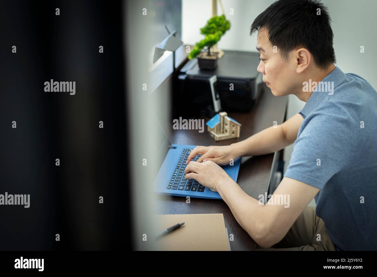Male architect working at laptop in office Stock Photo