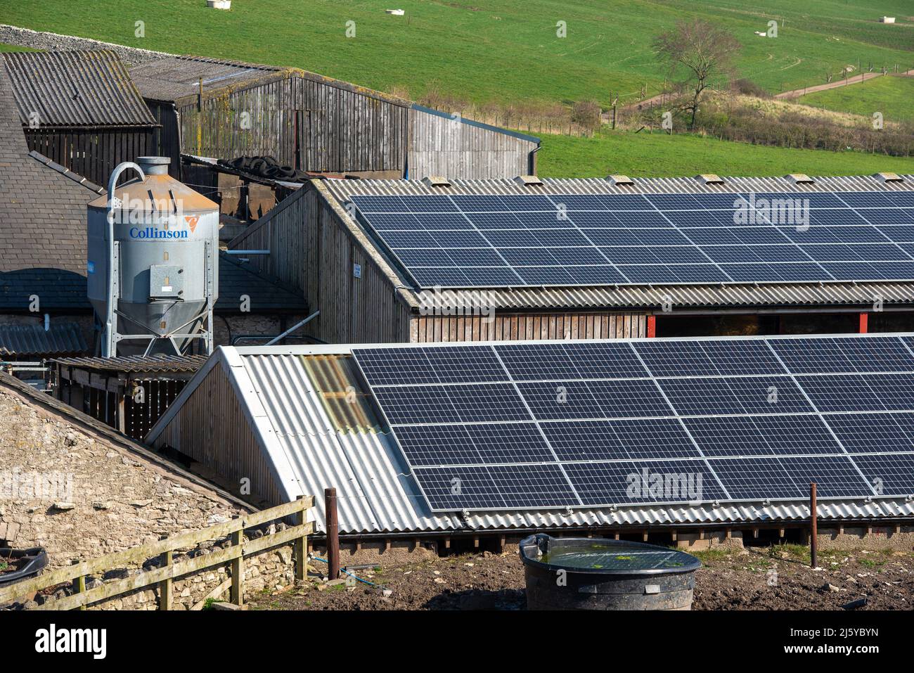 Solar panels on farm buildings, Arnside, Cumbria. Stock Photo