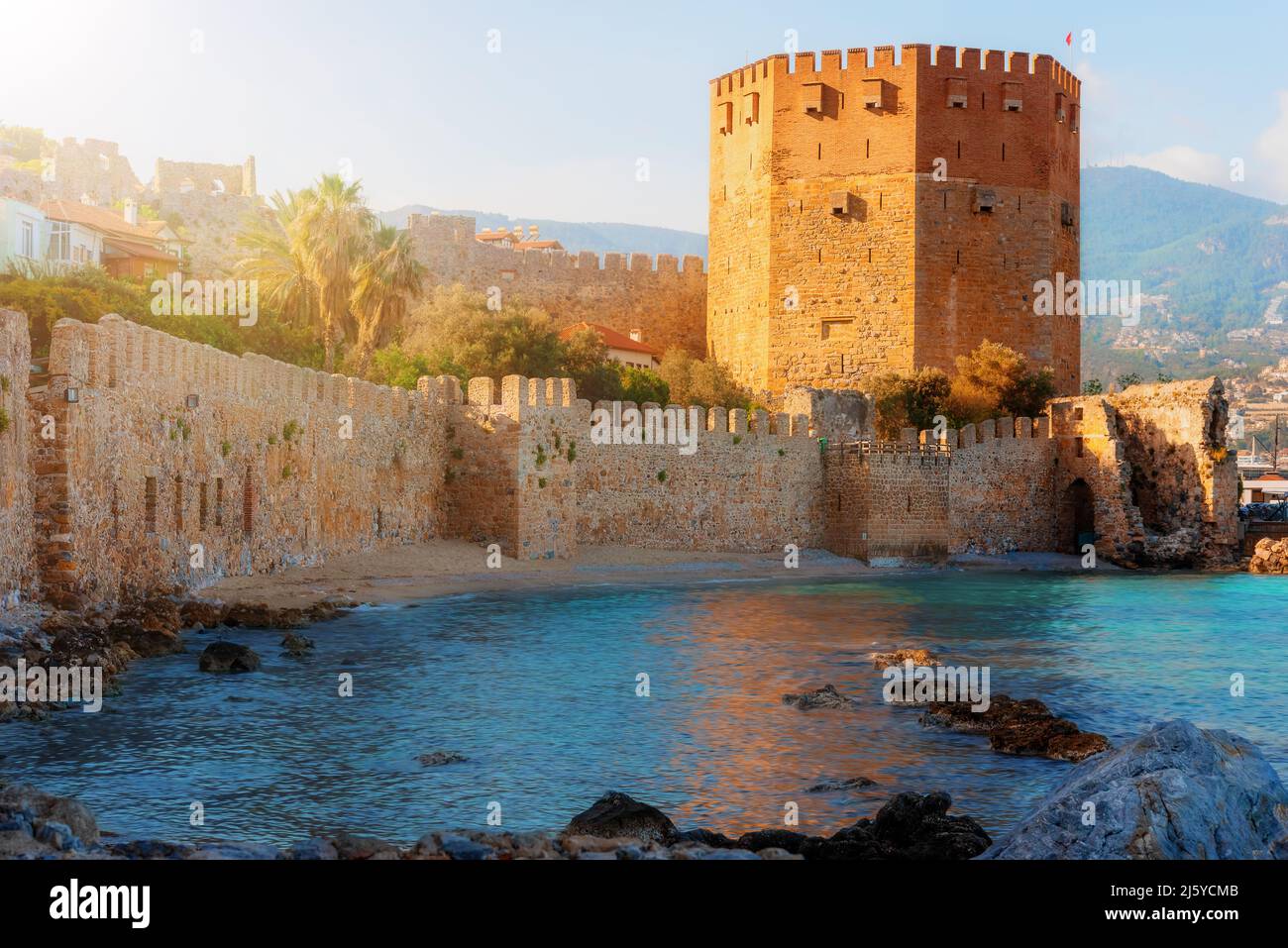 Landscape of an ancient shipyard near the Kyzyl Kule tower on the Alanya peninsula, Antalya region, Turkey at sunset. Stock Photo