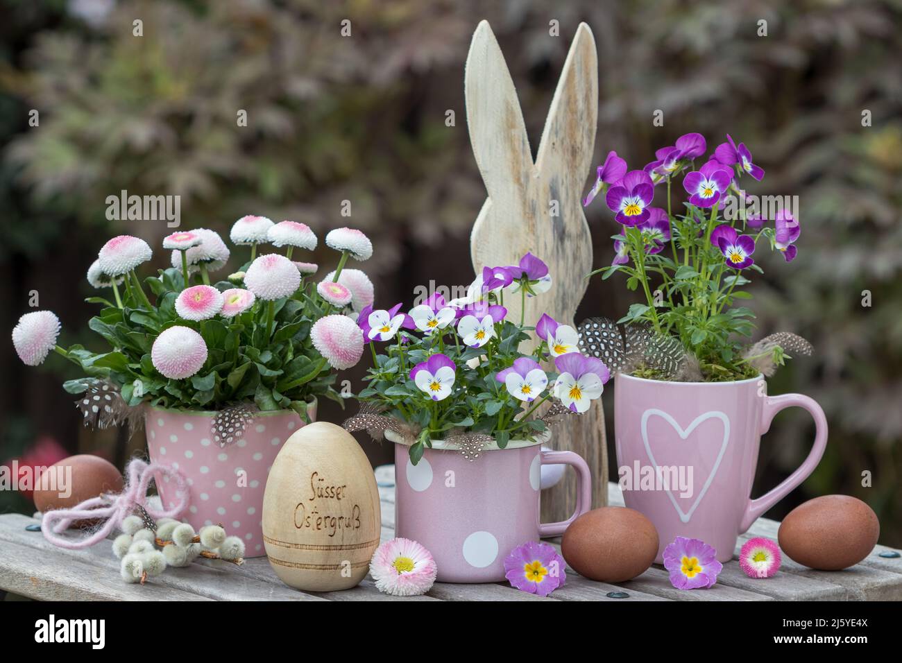 easter decoration with pink spring flowers, eggs and easter bunny Stock Photo