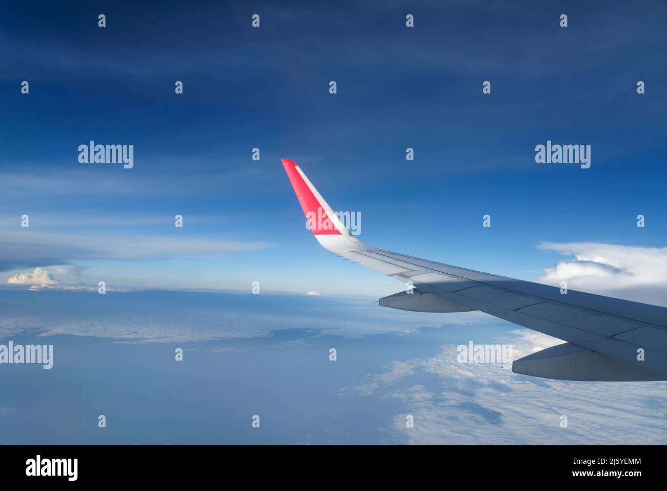 View of sky and clouds from aircraft window, on the way to Cochin, India. Stock Photo