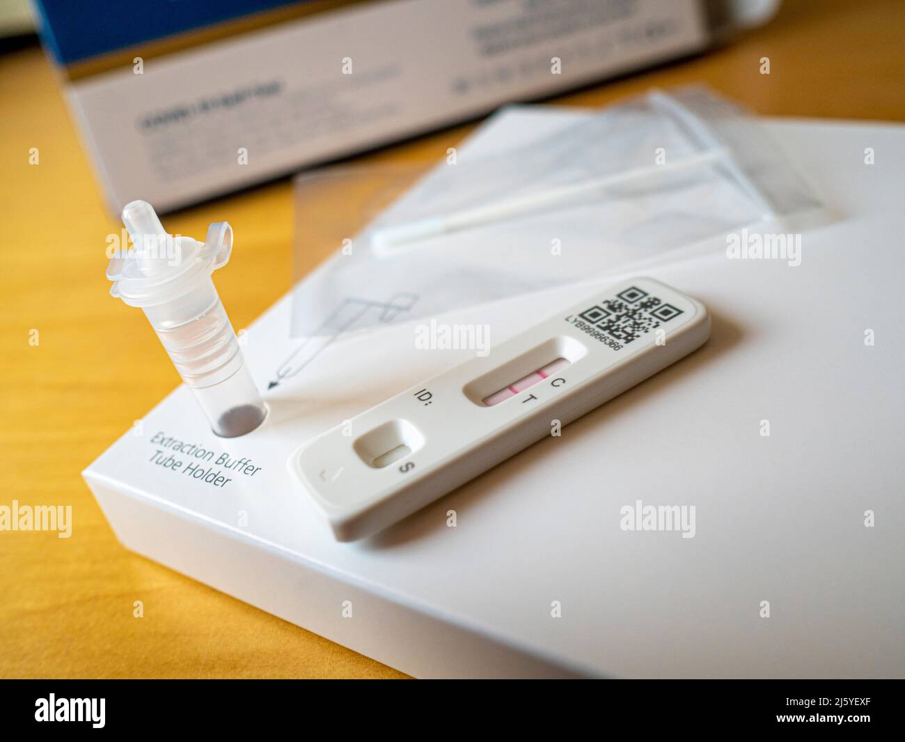 Covid-19 Lateral Flow test kit, with a positive result. UK. Stock Photo