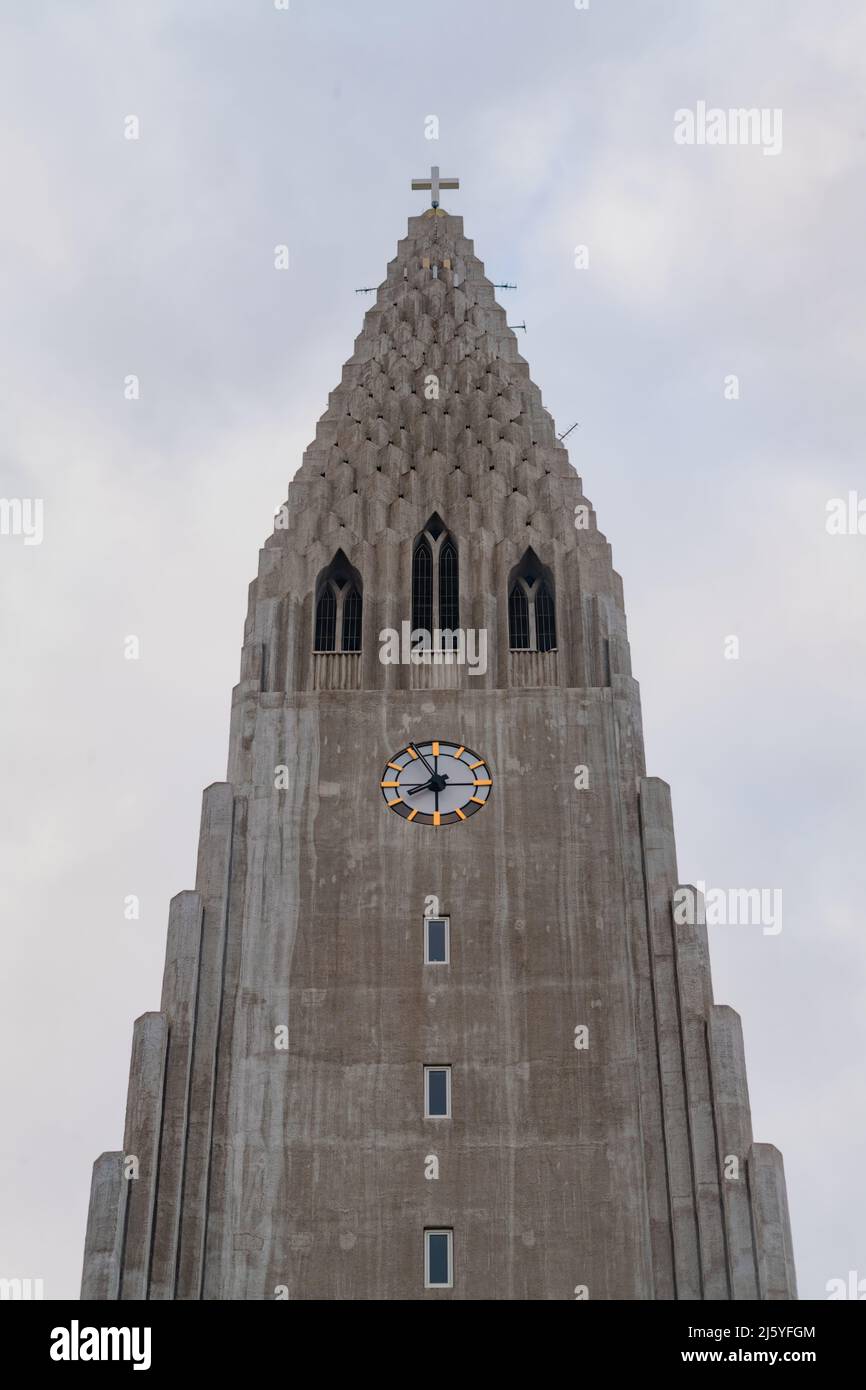 Spire of Hallgrims Church with clock in Reykjavik, Iceland Stock Photo