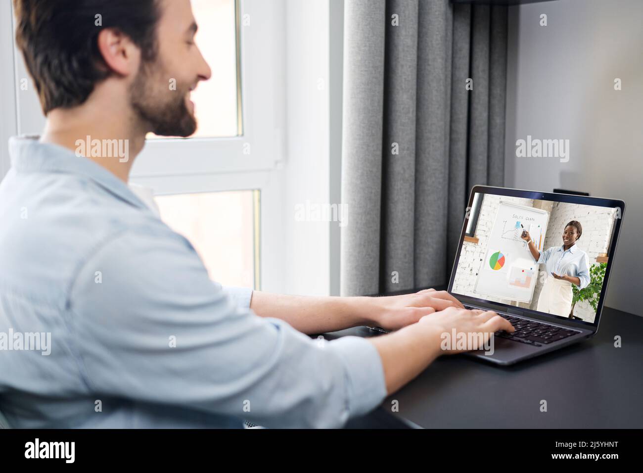 Virtual conference. Young man using pc for video call, having video ...