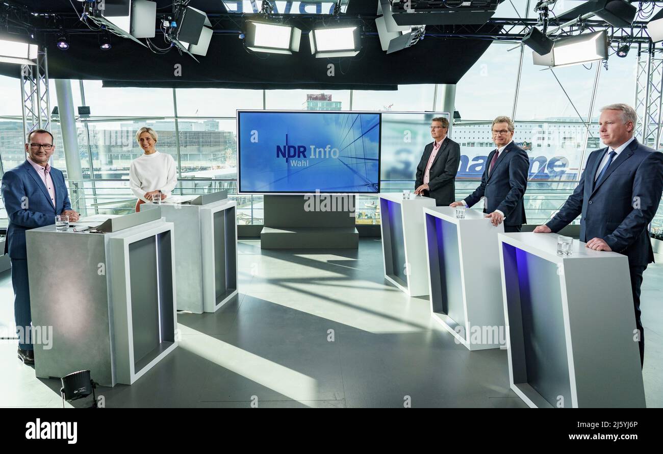 Kiel, Germany. 26th Apr, 2022. Presenters Stefan Böhnke (l-r) and Susanne Stichler and politicians Lars Harms (SSW, l-r), Bernd Buchholz (FDP), Minister of Economics of Schleswig-Holstein, and Jörg Nobis (AfD) stand in the NDR recording studio in the Norwegenkai terminal before the TV three-way round (Triell) ahead of the state election in Schleswig-Holstein. Credit: Axel Heimken/dpa/Alamy Live News Stock Photo