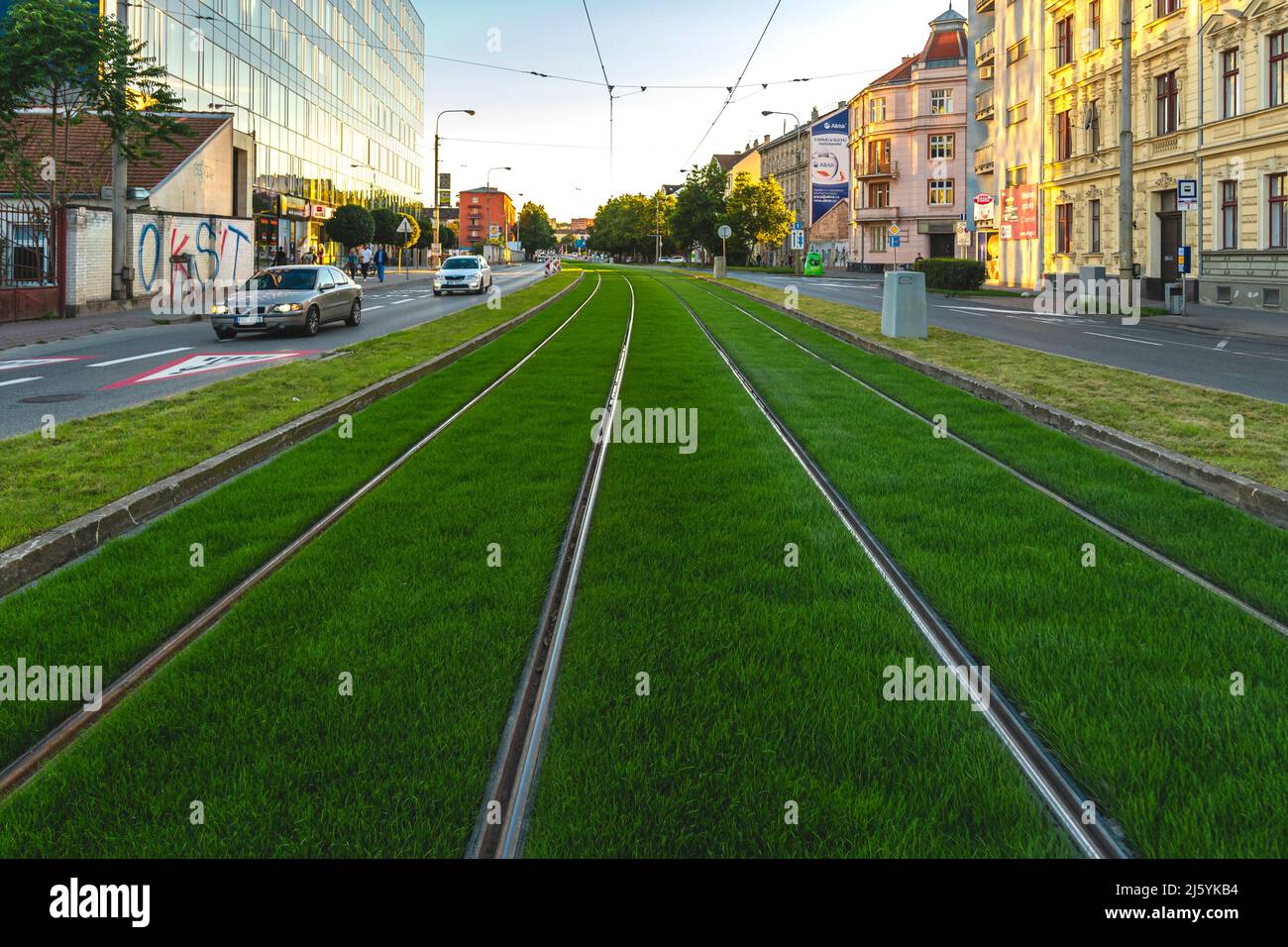 BRNO, Czech Republic - September, 5. 2020:Green track. Grass covered tramway track. Greenery in the city. Habitable zone reduce urban heat. Island Stock Photo