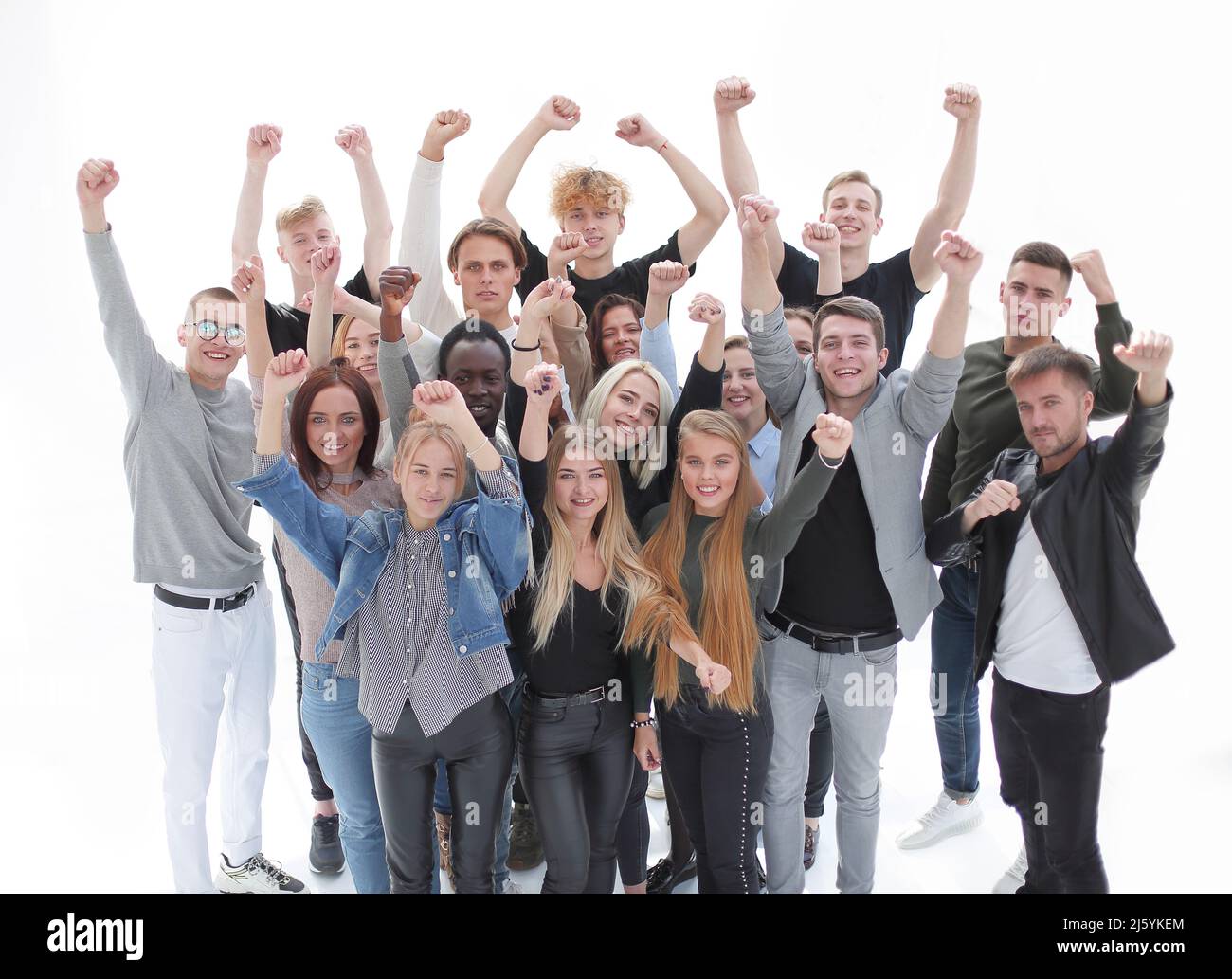 large group of happy young people with hands up. isolated on white ...