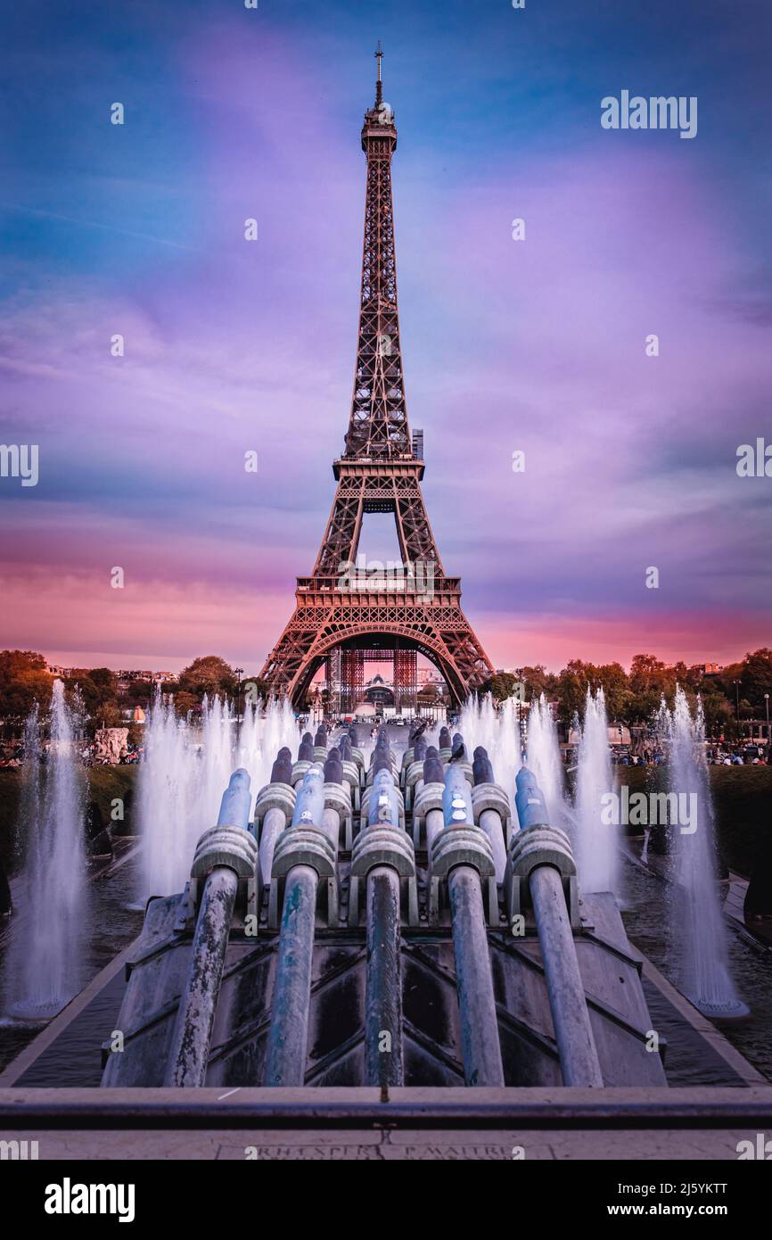 View of Eiffel Tower and fountain at beautiful sunset in Paris, France. Stock Photo