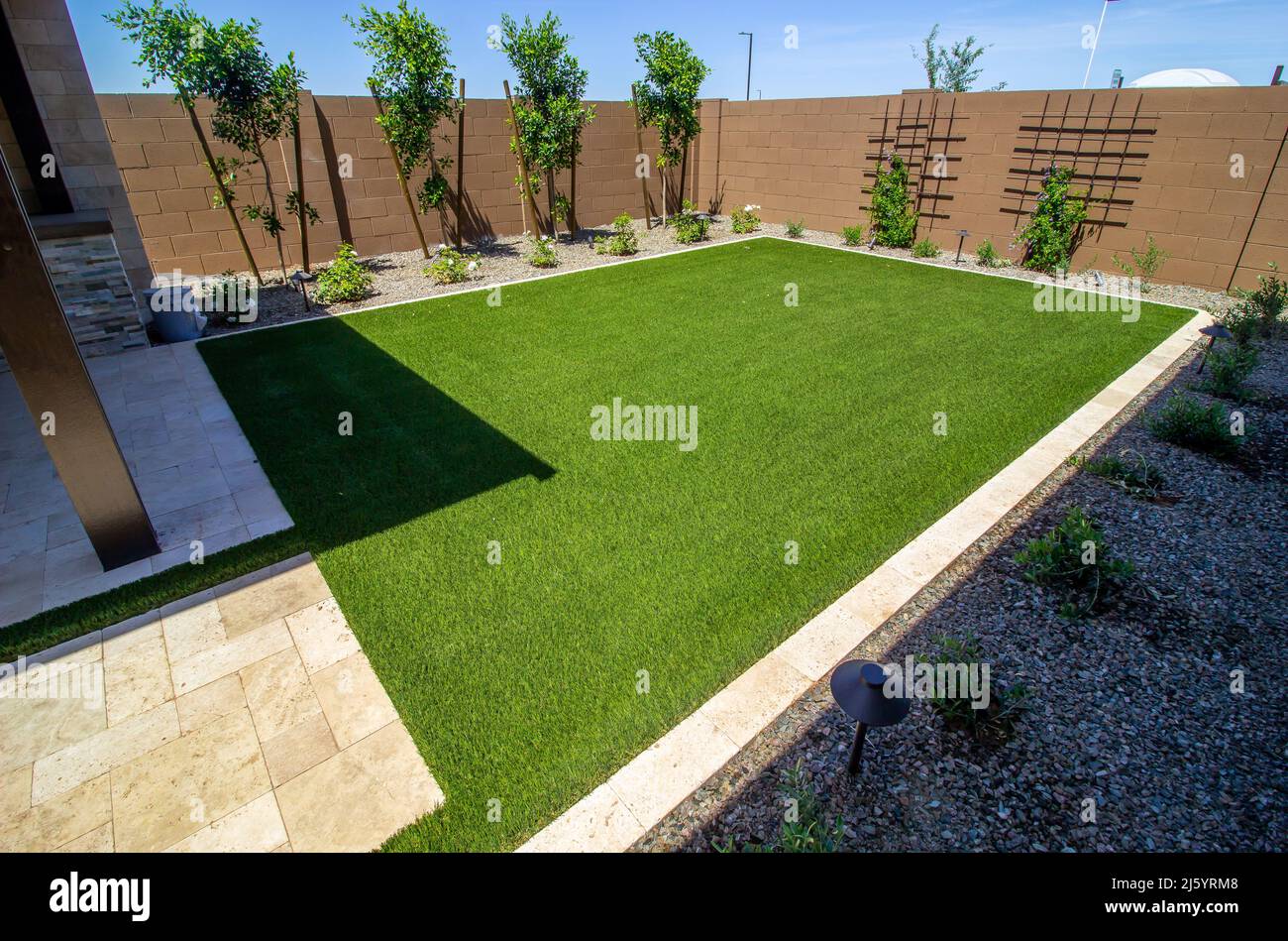 Landscaped Rear Yard Setting With Vine Trestles Stock Photo