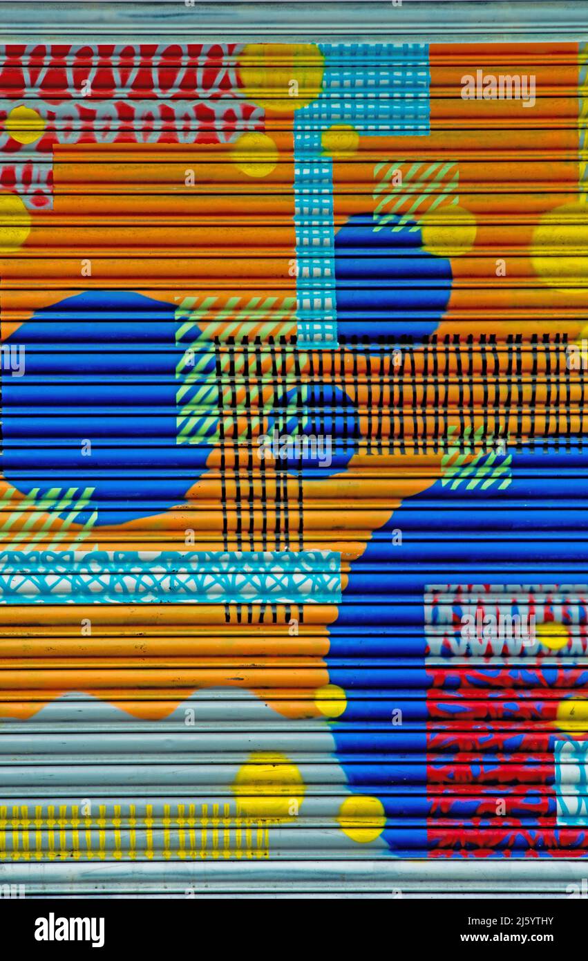 Street Art on metal shutters, Manchester, England Stock Photo