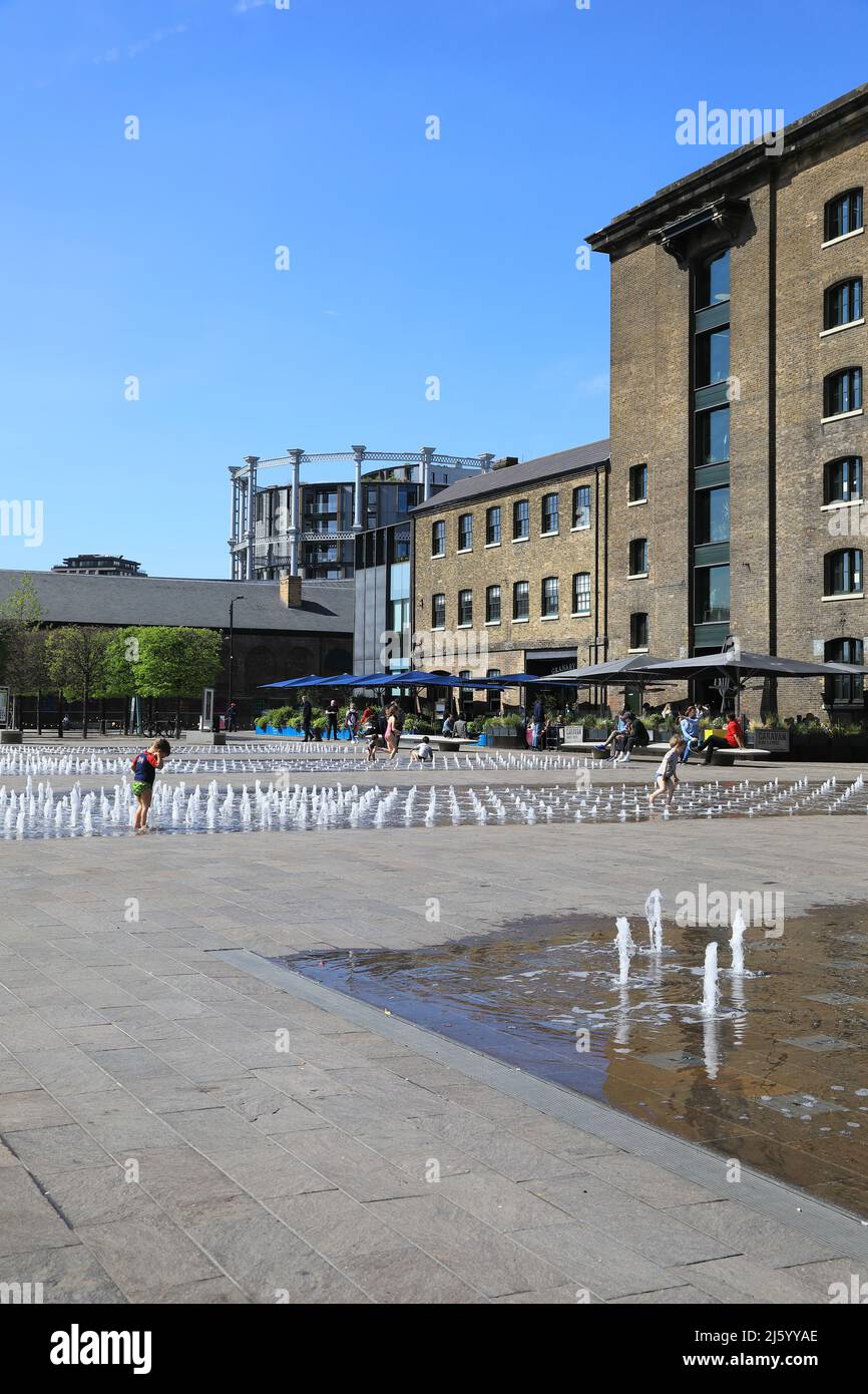 The fountains on Granary Square in spring sunshine, at Kings Cross