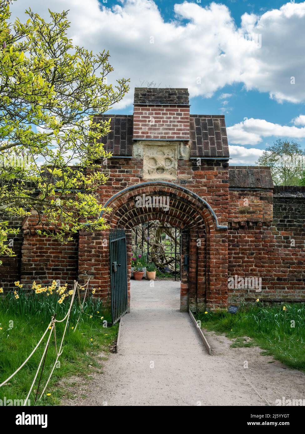 Brick gate of the entrance to Fulham House and Garden Park in London, in the spring season, UK Stock Photo