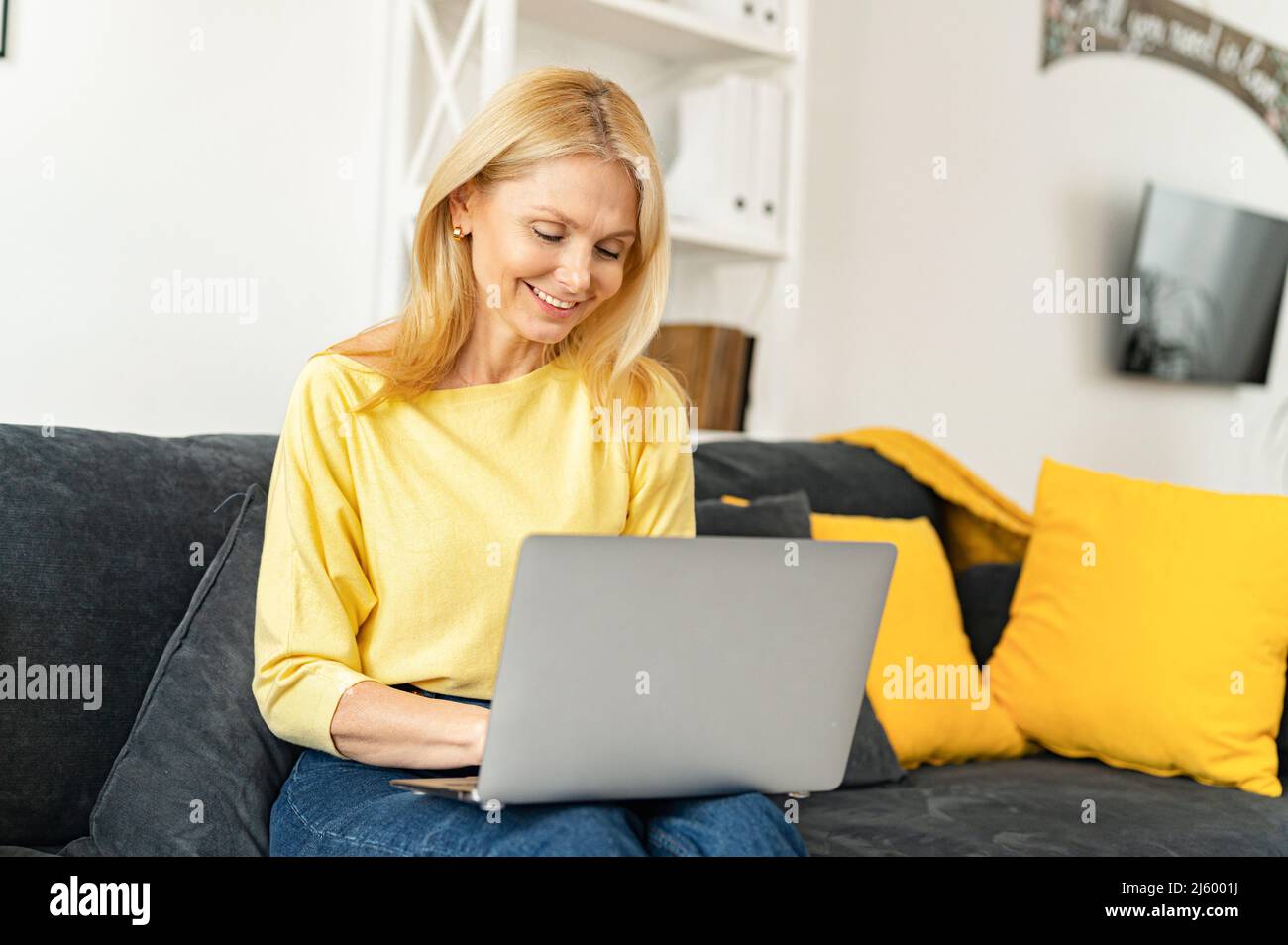 Woman jumper computer home writing hi-res stock photography and images ...