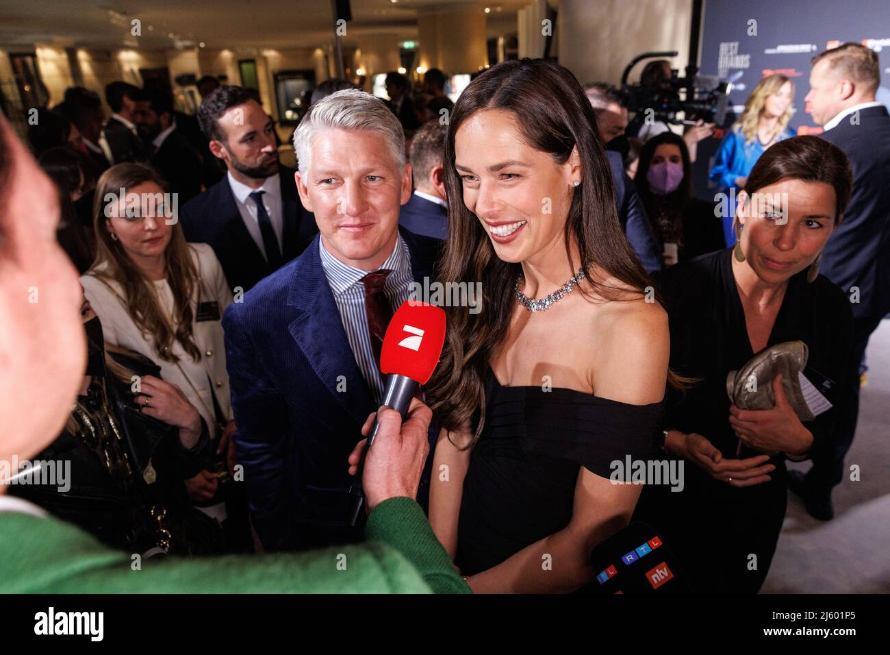 Munich, Germany. 26th Apr, 2022. Bastian Schweinsteiger, former German soccer player, and his wife Ana Ivanovic, Serbian former tennis player, arrive at the Best Brands Awards 2022 ceremony at the Bayerischer Hof. Credit: Matthias Balk/dpa/Alamy Live News Stock Photo