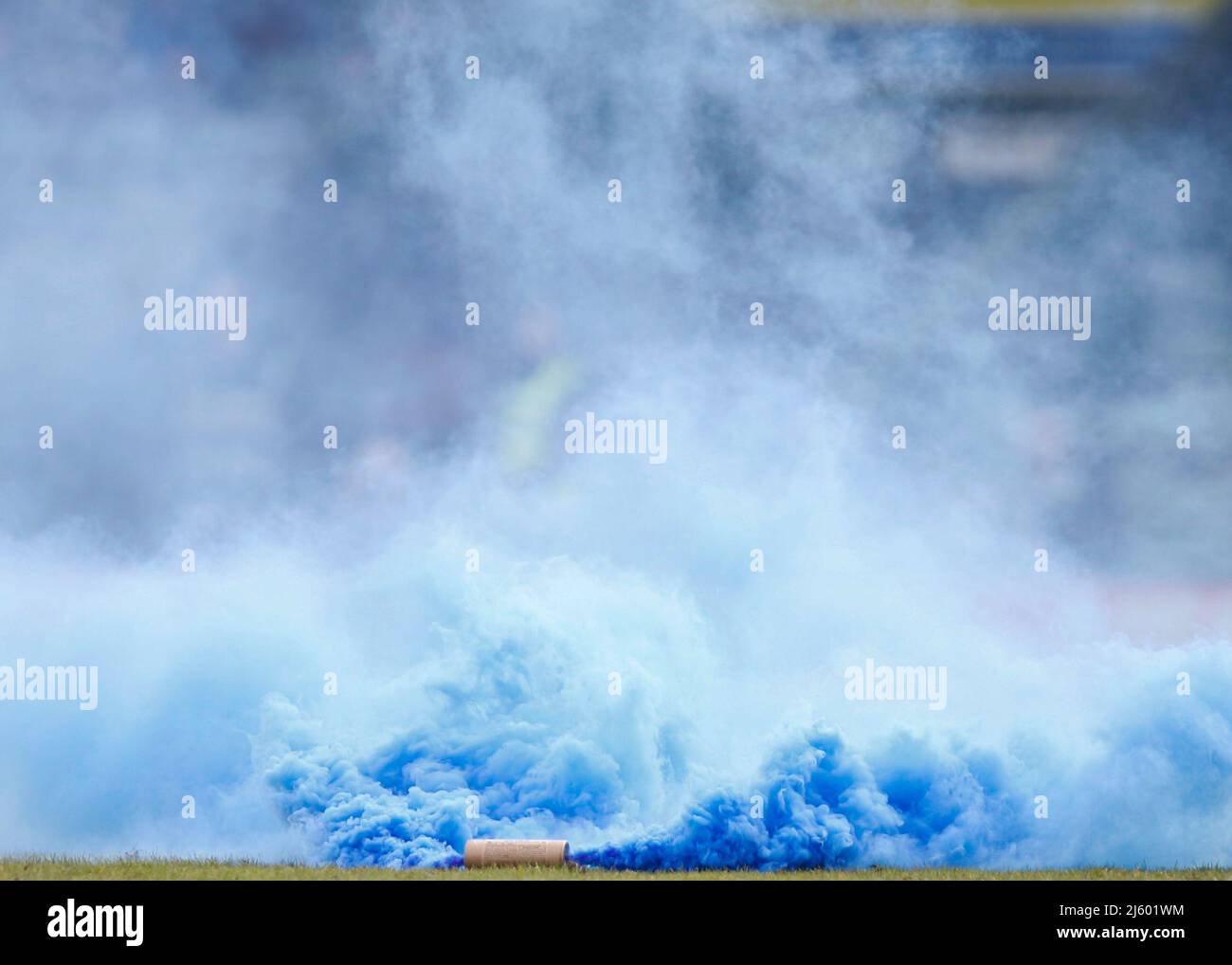 Blue Smoke grenade thrown onto pitch by Stockport County fans Stock