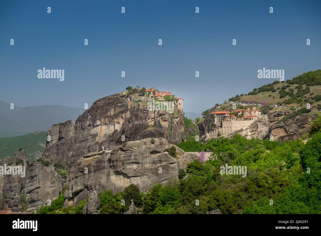 Landscape of Greek Eastern Orthodox Monasteries on top of steep rocks ...