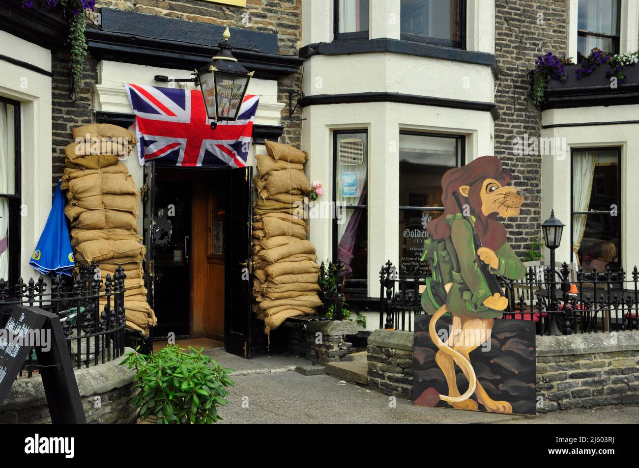 The Golden Lion family pub in the heart of the town of Leyburn in the Yorkshire Dales, decked out for a WW2 event in the summer of 2016. A sandbagged Stock Photo