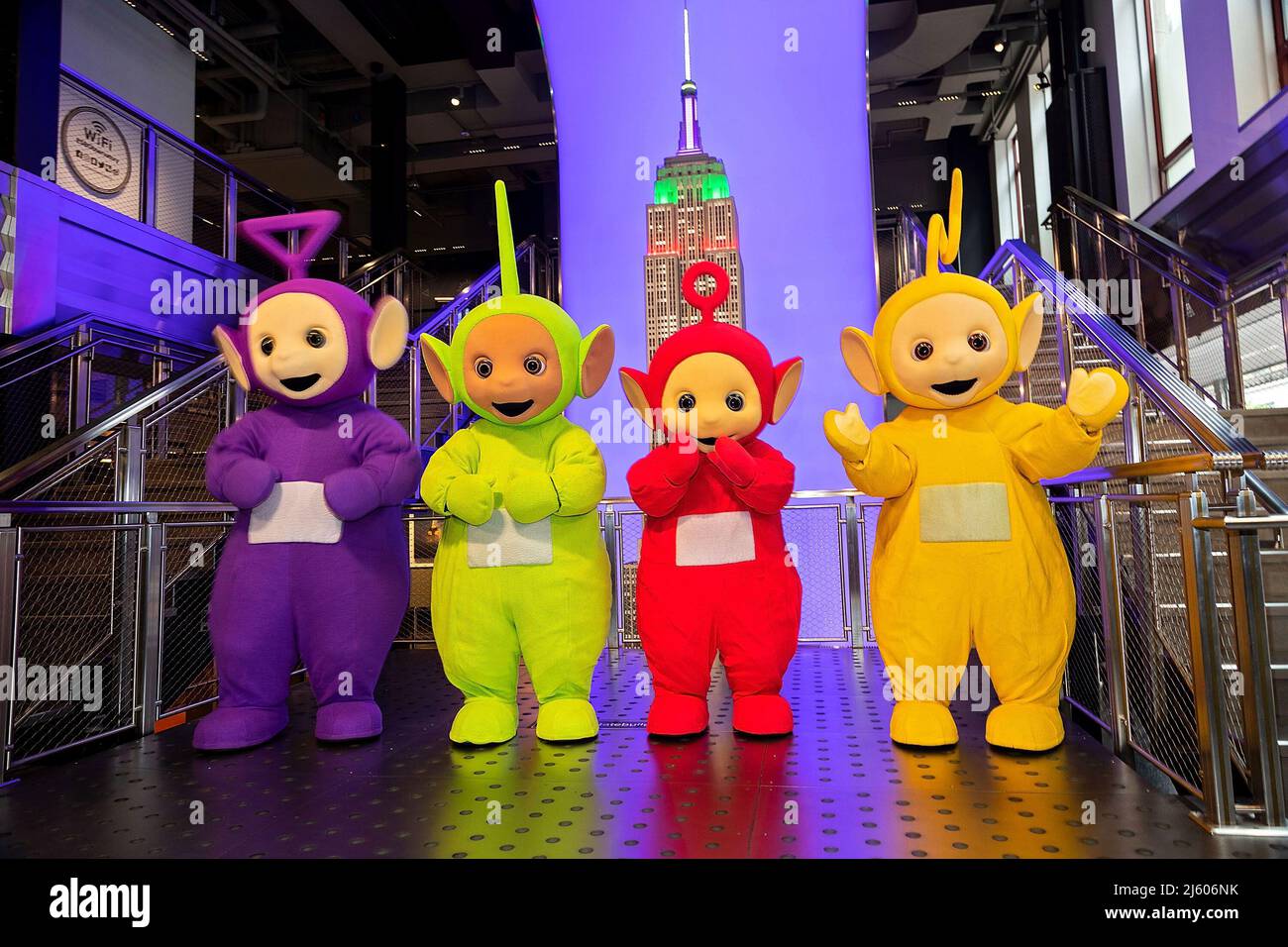 New York, NY, USA. 26th Apr, 2022. Tinky Winky, Dipsy, Po, Laa-Laa at the Teletubbies ceremonial lighting of the Empire State Building in their iconic colors of purple, green, yellow and red in celebration of their 25th Anniversary year at The Empire State Building. Credit: Steve Mack/Alamy Live News Stock Photo