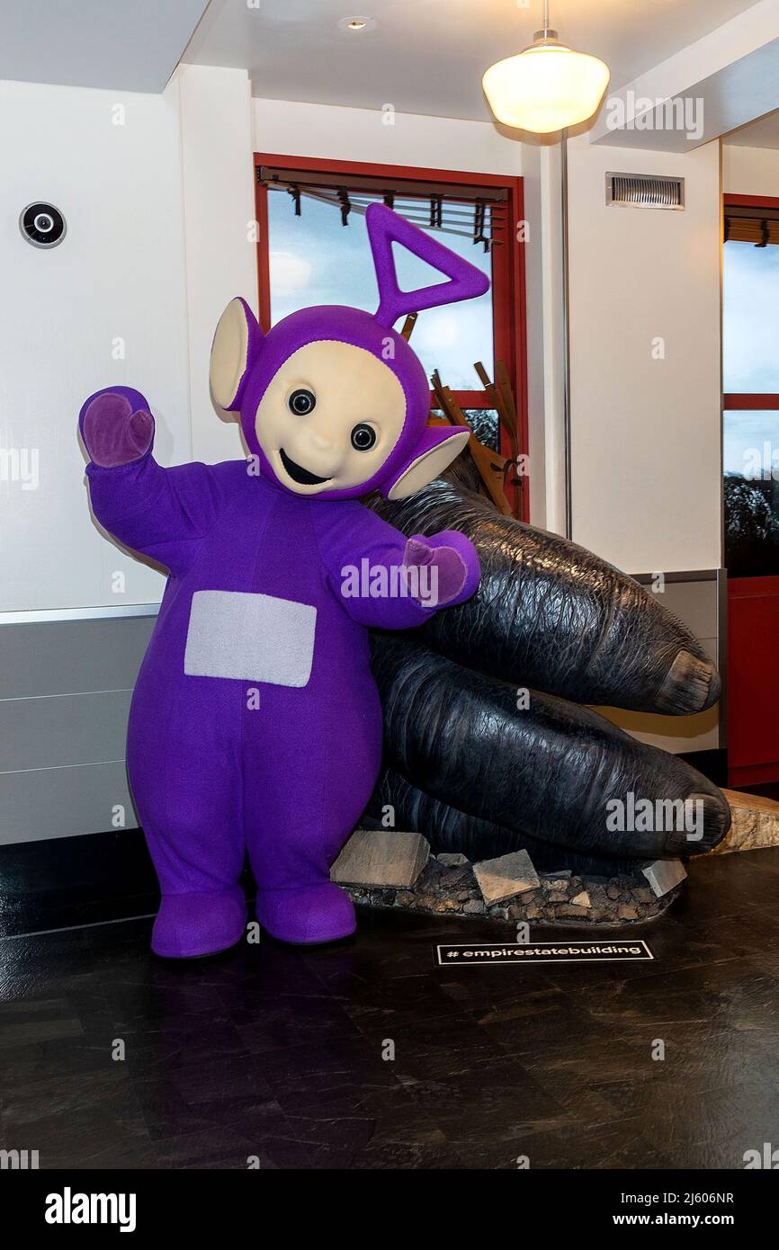 New York, NY, USA. 26th Apr, 2022. Tinky Winky at the Teletubbies ceremonial lighting of the Empire State Building in their iconic colors of purple, green, yellow and red in celebration of their 25th Anniversary year at The Empire State Building. Credit: Steve Mack/Alamy Live News Stock Photo
