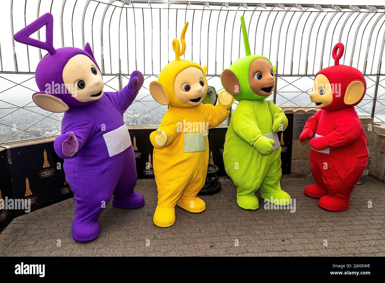 New York, NY, USA. 26th Apr, 2022. Tinky Winky, Laa-Laa, Dipsy, Po at the Teletubbies ceremonial lighting of the Empire State Building in their iconic colors of purple, green, yellow and red in celebration of their 25th Anniversary year at The Empire State Building. Credit: Steve Mack/Alamy Live News Stock Photo