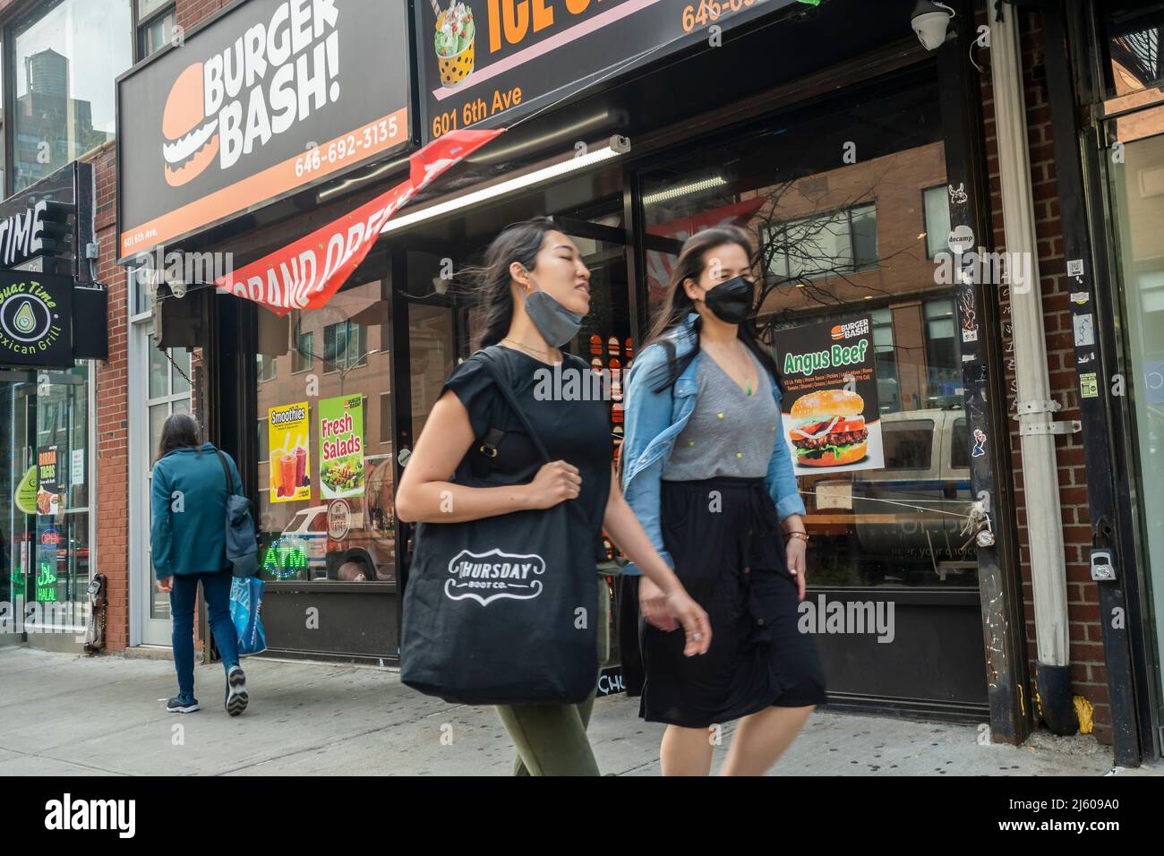 Grand opening of Burger Bash fast food and Rolling Fresh Ice Cream sharing a storefront in Chelsea in New York on Wednesday, April 13 2022.  (© Richard B. Levine) Stock Photo