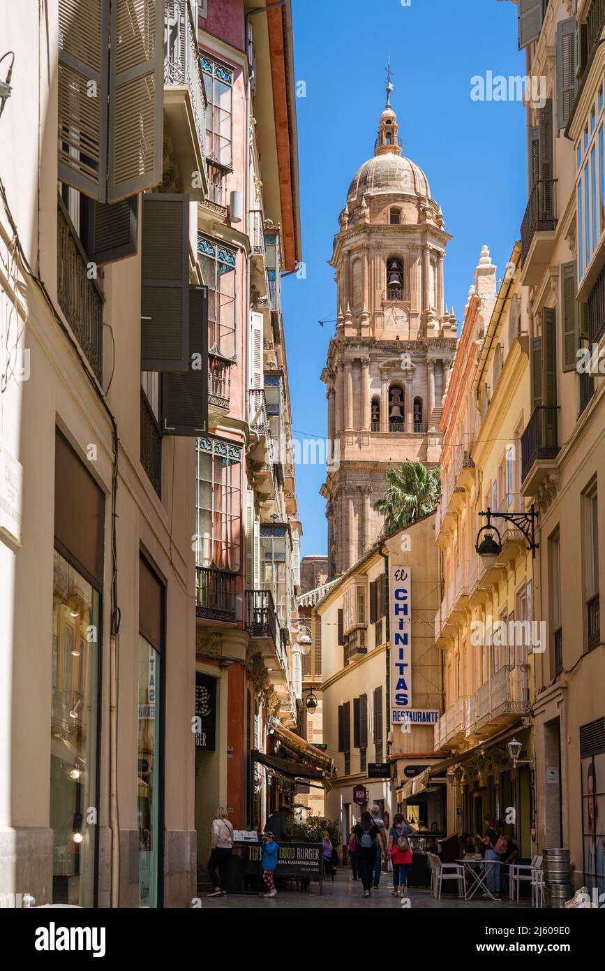 Malaga, SPAIN - April 21 2022: Streets of Malaga. Old town Malaga Small  streets , promenade area with shops and restaurants Stock Photo - Alamy, image size:867x1390