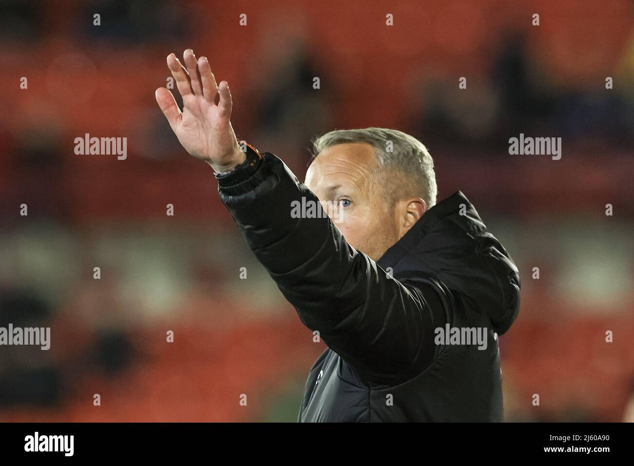 Neil Critchley head coach of Blackpool waves to the fans as the chant