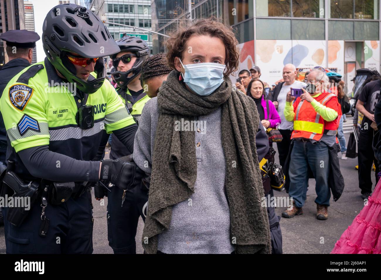 Environmental activists affiliated with Extinction Rebellion perform civil disobedience by blocking traffic on Sixth Avenue in New York on Saturday, April 23, 2022. The protest called attention to the inactivity of government to stop climate catastrophe, the protesters were subsequently arrested(© Richard B. Levine) Stock Photo