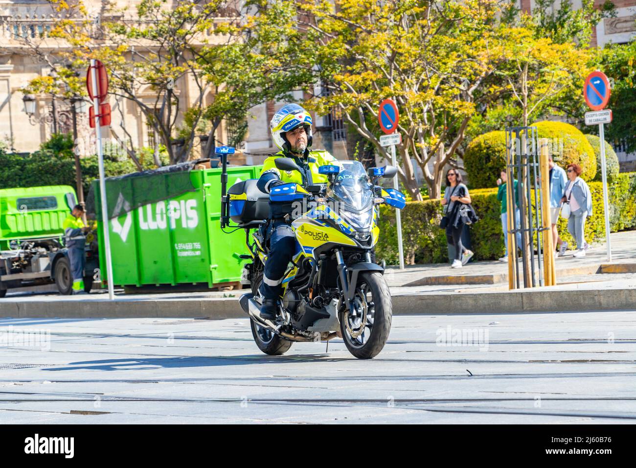 spanish police motorcyclist motorbike and rider in Seville Sevilla spain  driving on road Stock Photo