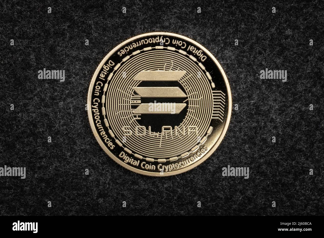 Solana SOL cryptocurrency physical coin on a dark background. Stock Photo