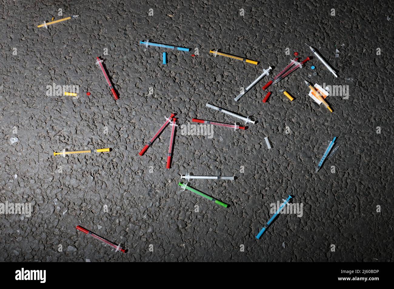 A load of colourful drug needles found in the street in Exeter, Devon, UK. Stock Photo
