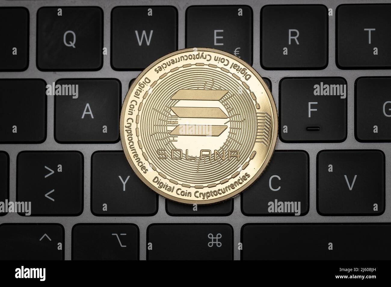 Solana SOL cryptocurrency physical coin on a keyboard. Stock Photo