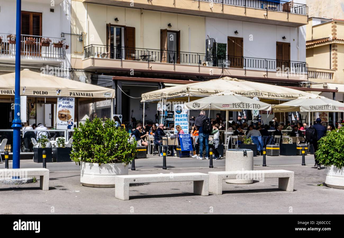 Dining out in the village of Mondello, Sicily, Italy. Stock Photo