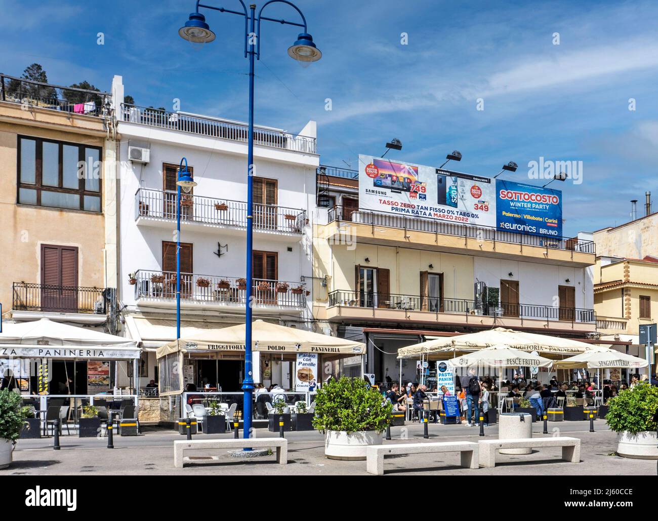 The village centre of Mondello, a small village near Palermo, Sicily, Italy with many restaurants and outdoor dining. Stock Photo