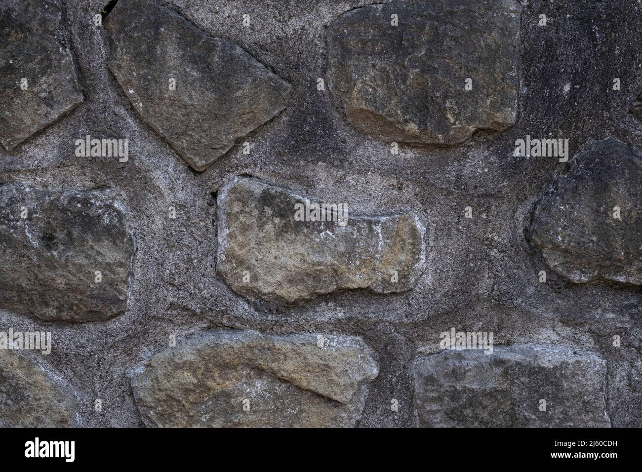 Old gray stone and mortar wall background texture Stock Photo