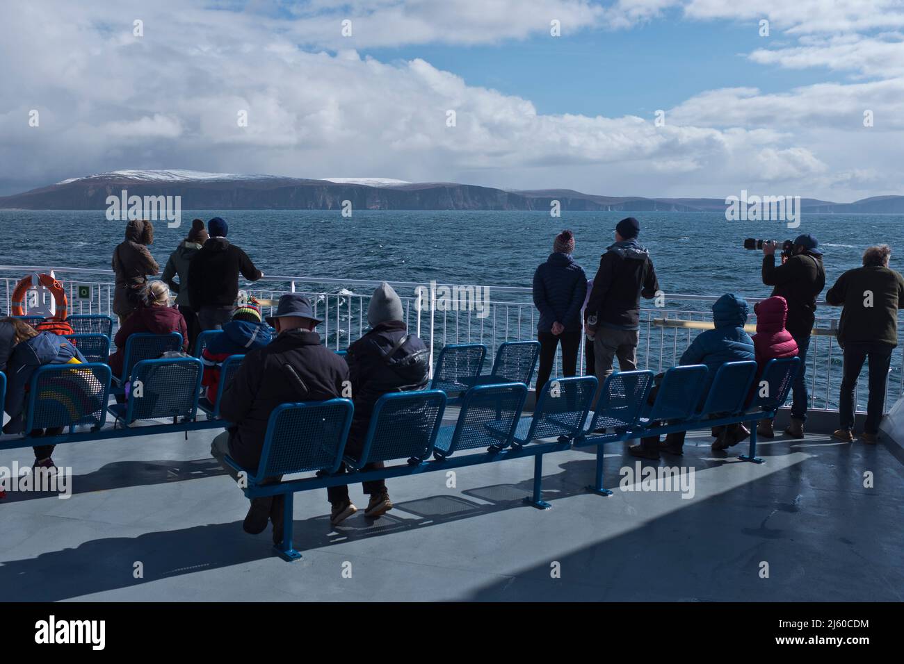 dh MV Hamnavoe PENTLAND FIRTH SCOTLAND Passengers springtime tourists aboard ferry deck Stock Photo